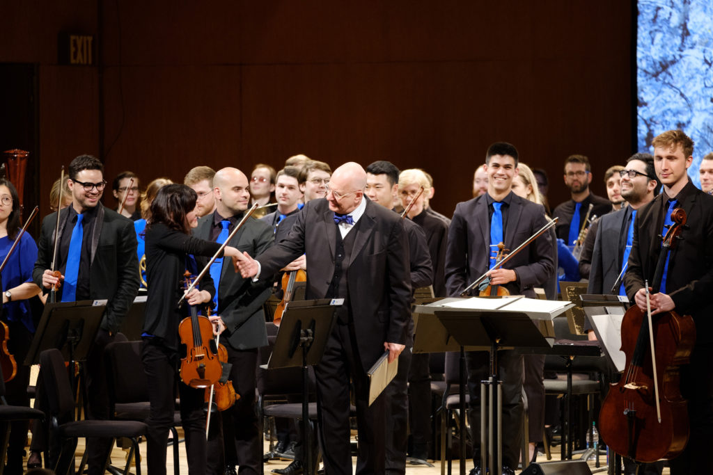 Conductor Leon Botstein shakes hands with concertmaster Yurie Mitsuhashi at the Metropolitan Museum on Sun 5-19-19